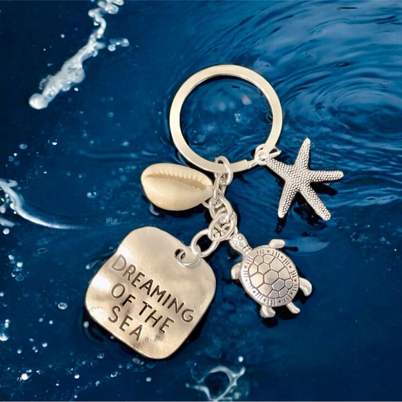 Silver Beachy keychain. Starfish, shell, and turtle charms. NWT. - Picture 4 of 4